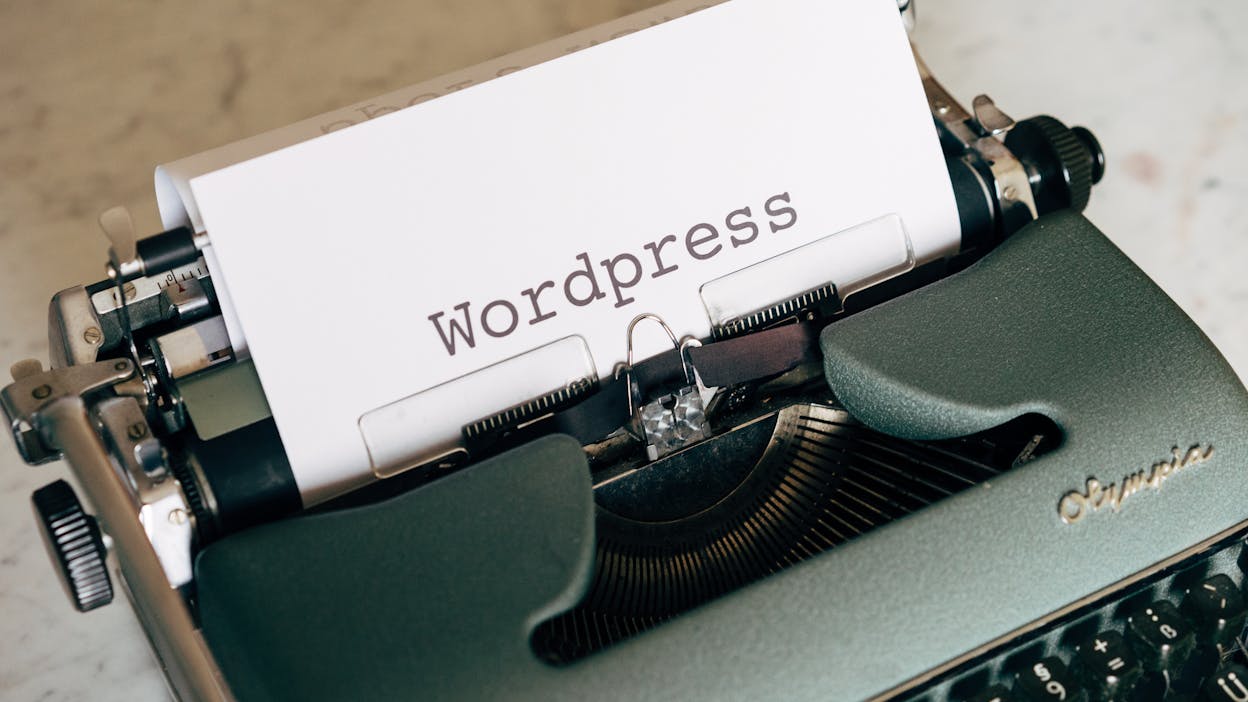 Close-up of a vintage typewriter with paper labeled Wordpress.